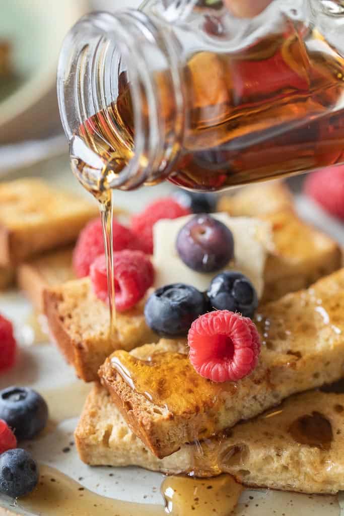 syrup drizzled over the top of french toast sticks