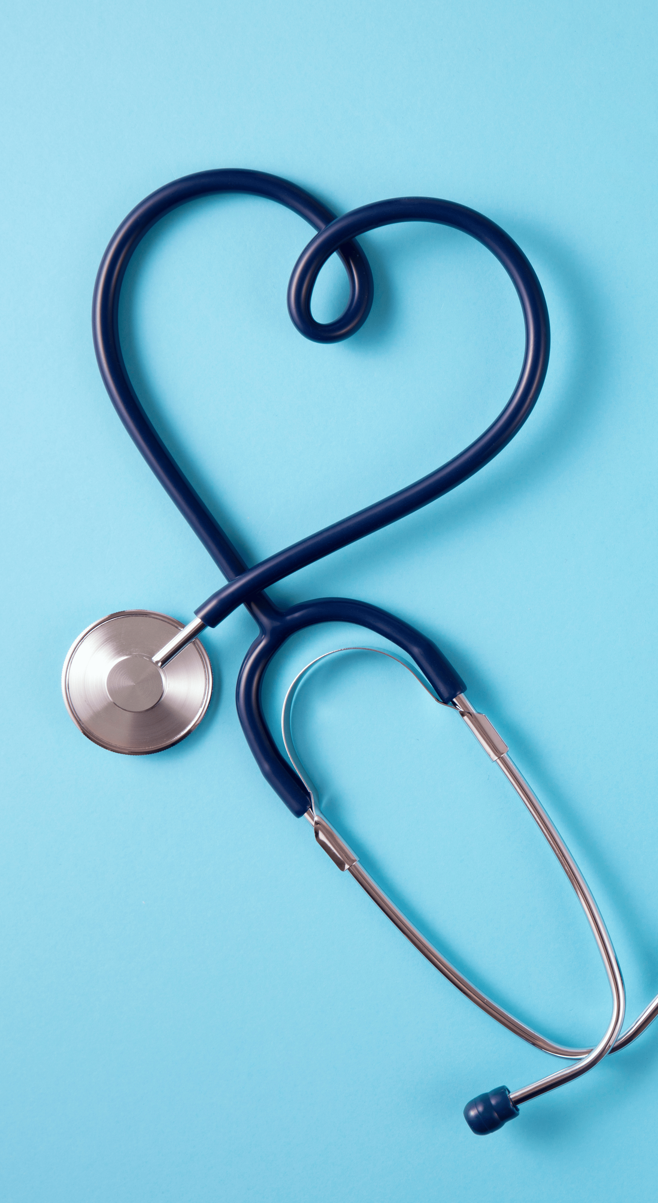 a woman in a white shirt holding a stethoscope