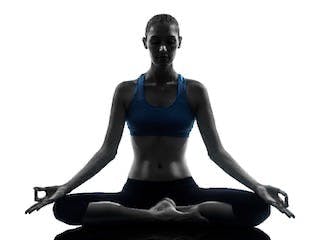 A woman practicing seated meditation.