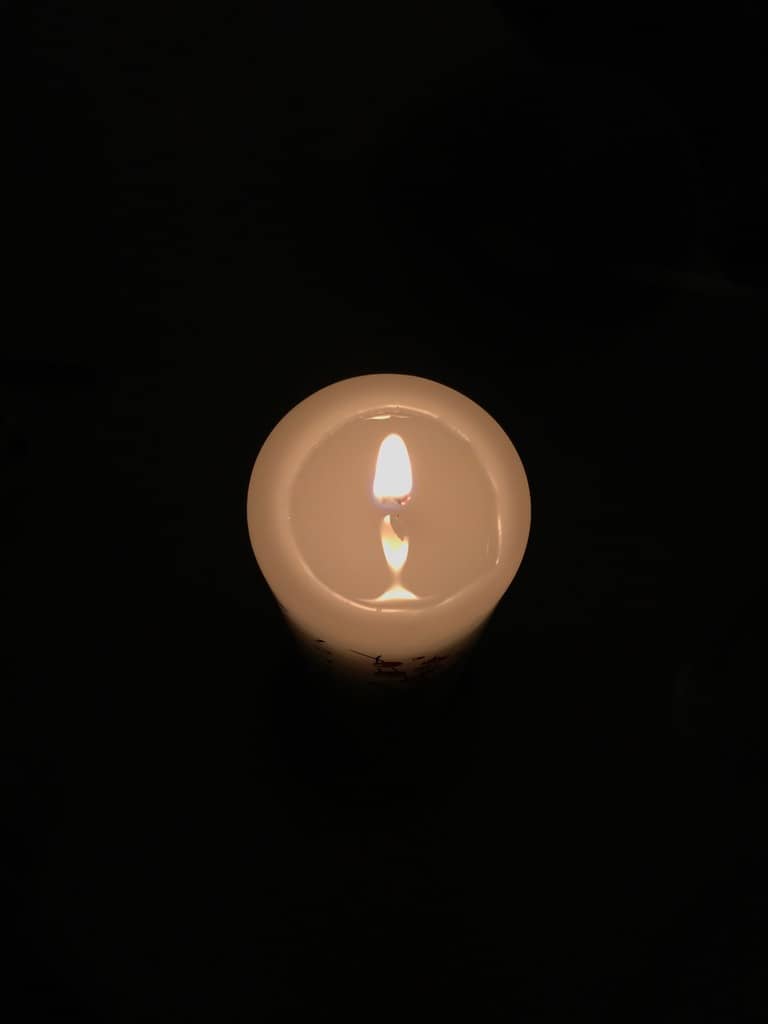 Photo of a candle in the dark