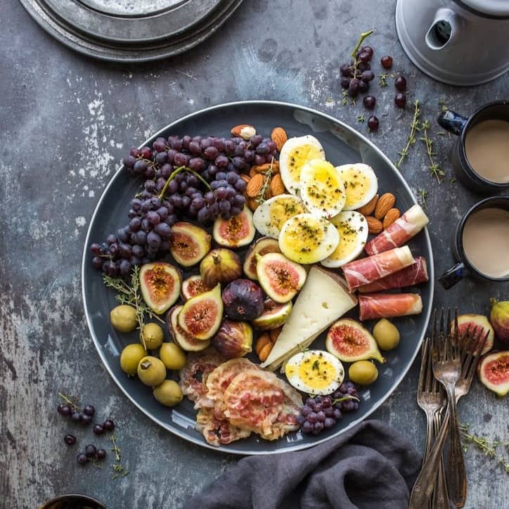 top view photography of fruits in plate