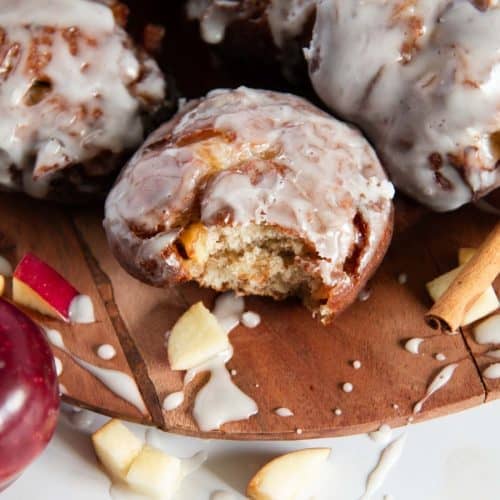 an apple fritter with a bite taken out of it 