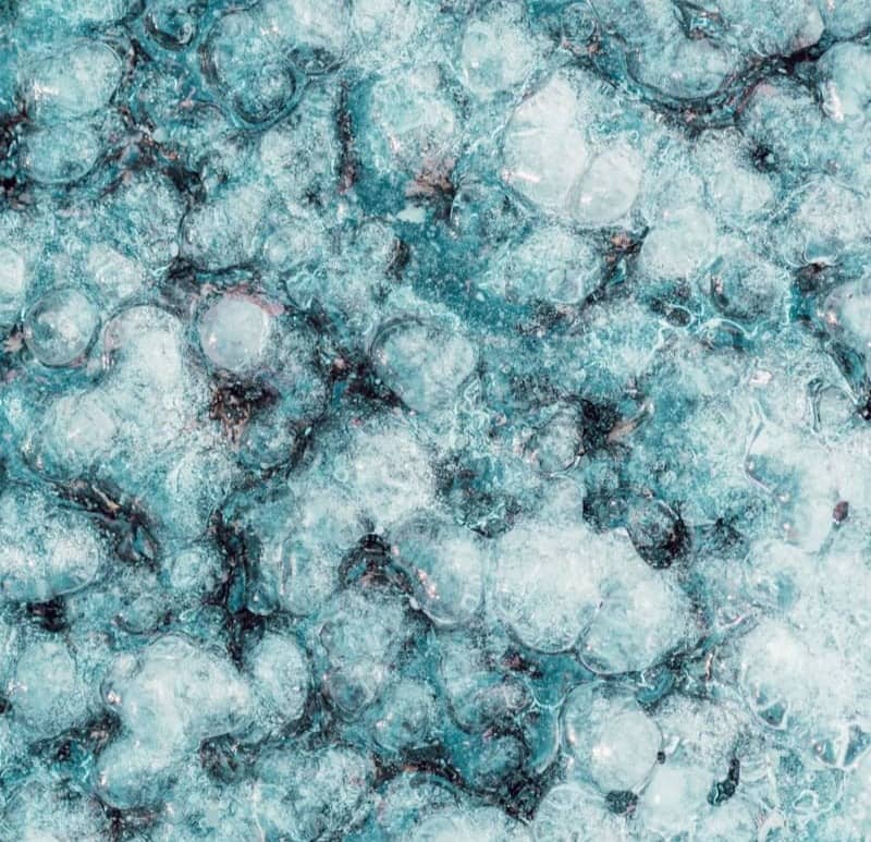 Frosted ice pattern with circular, bubbling texture.