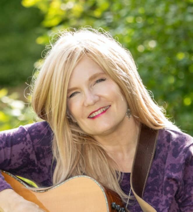 Blond Smiling with Guitar