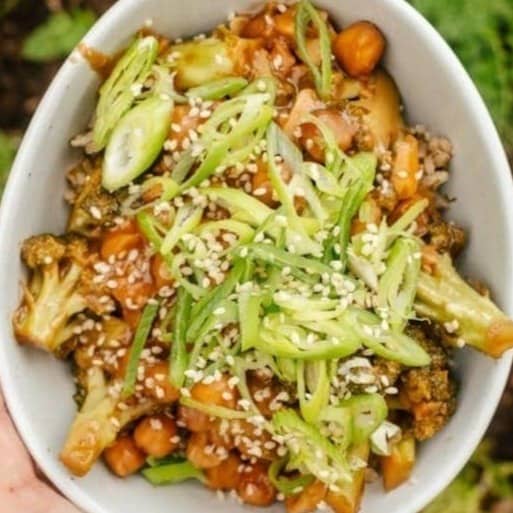 roasted cauliflower and carrots with sesame seeds and sliced green onions