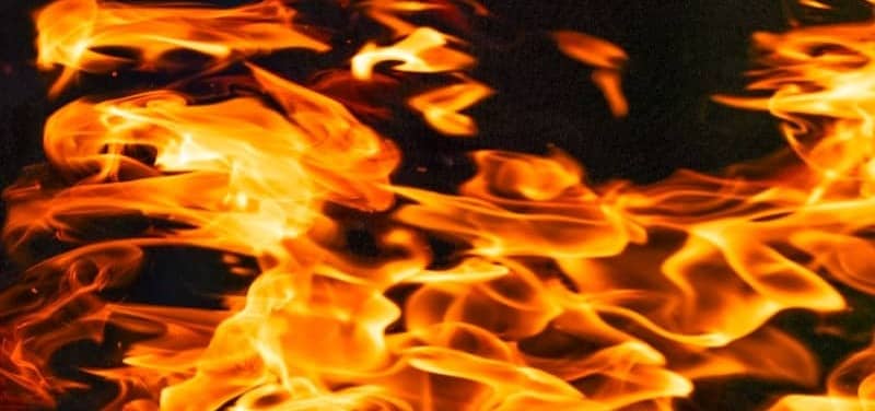 Flames are burning brightly against a dark backdrop.