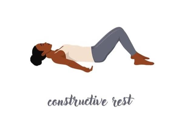 image is of a black woman laying on her back with knees up and eyes closed