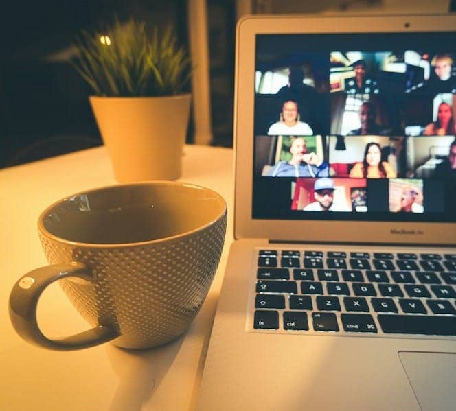 macbook air displaying woman in white shirt