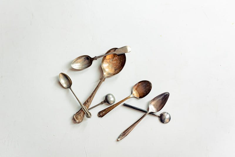 multiple spoons against a white backgrouns