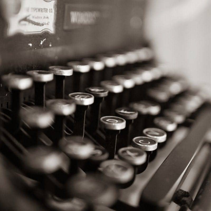 black and white typewriter on table