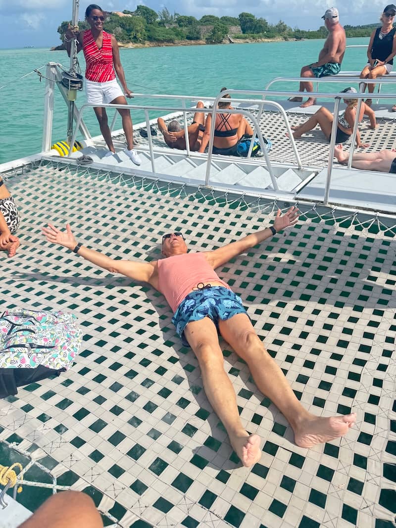 people lounging on a catamaran