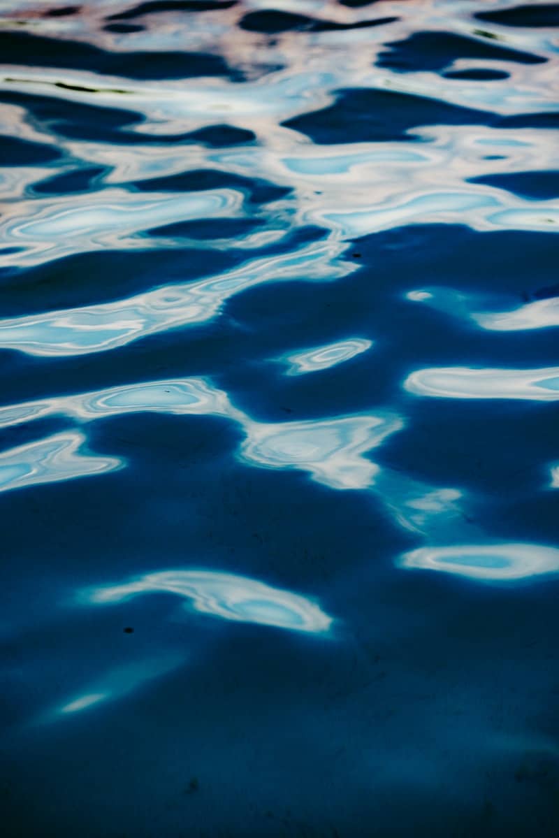 Rippling blue water with light reflections