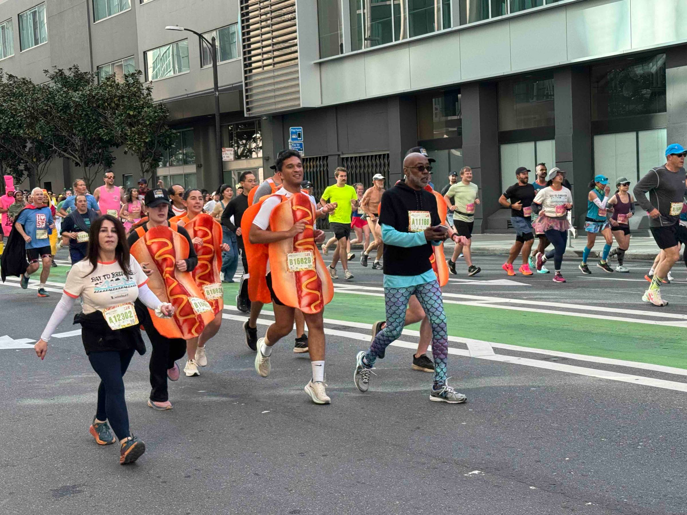people dressed as hot dogs running