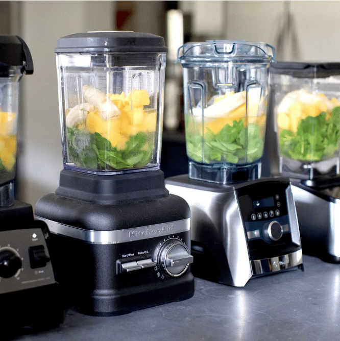 variety of blenders lined up on kitchen counter 