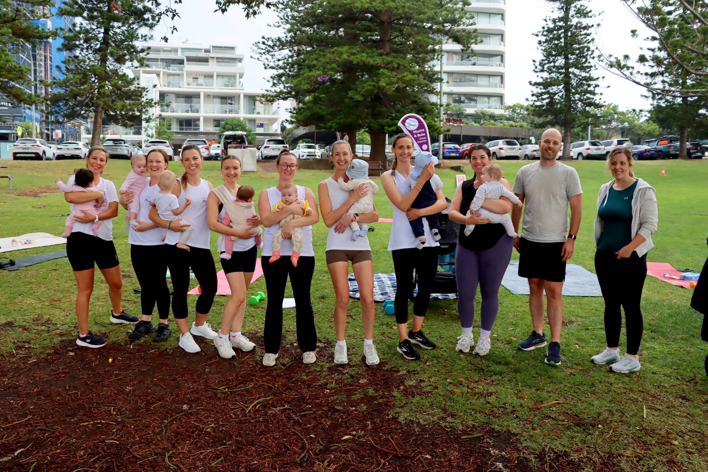 women exercising outdoors with babies