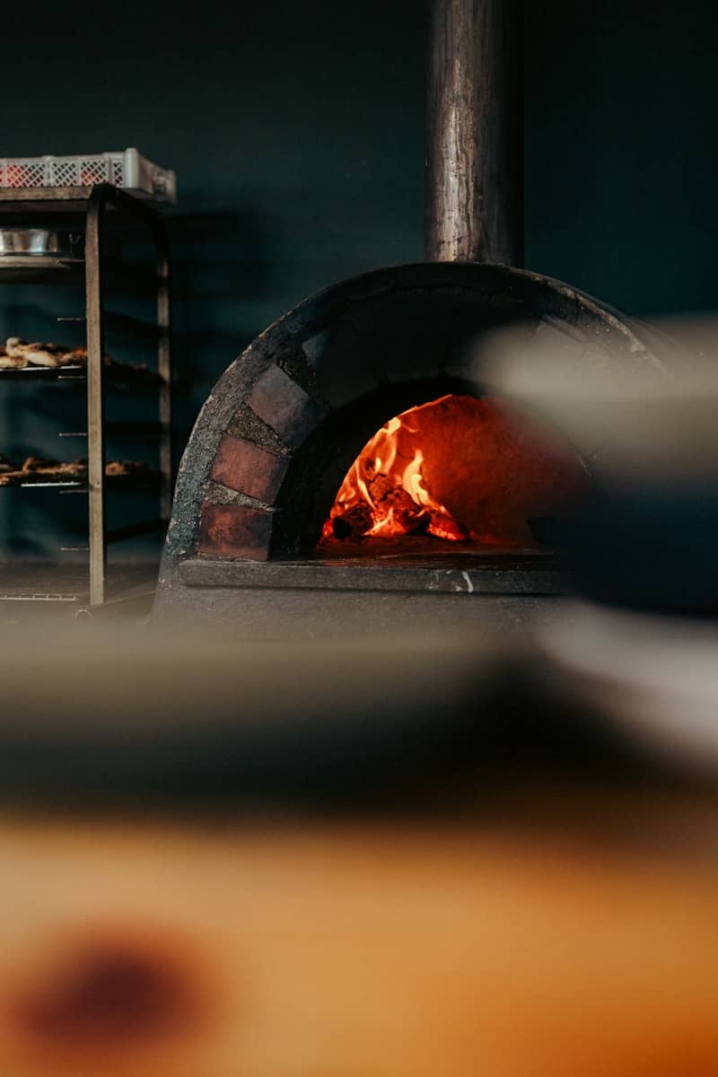 A brick oven with a fire inside of it