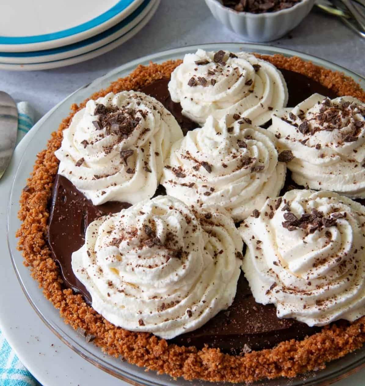 whole microwave chocolate pie with whipped cream and chocolate sprinkles on top