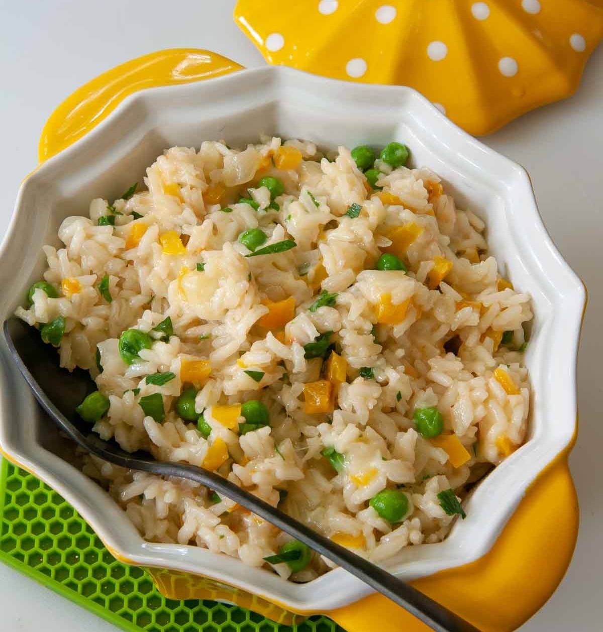 Ready-to-eat Cheesy Rice Pilaf with Peas in a serving bowl
