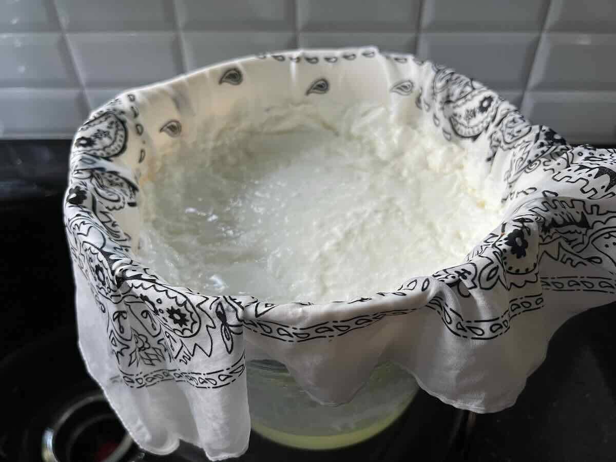 straining yogurt with a handkerchief