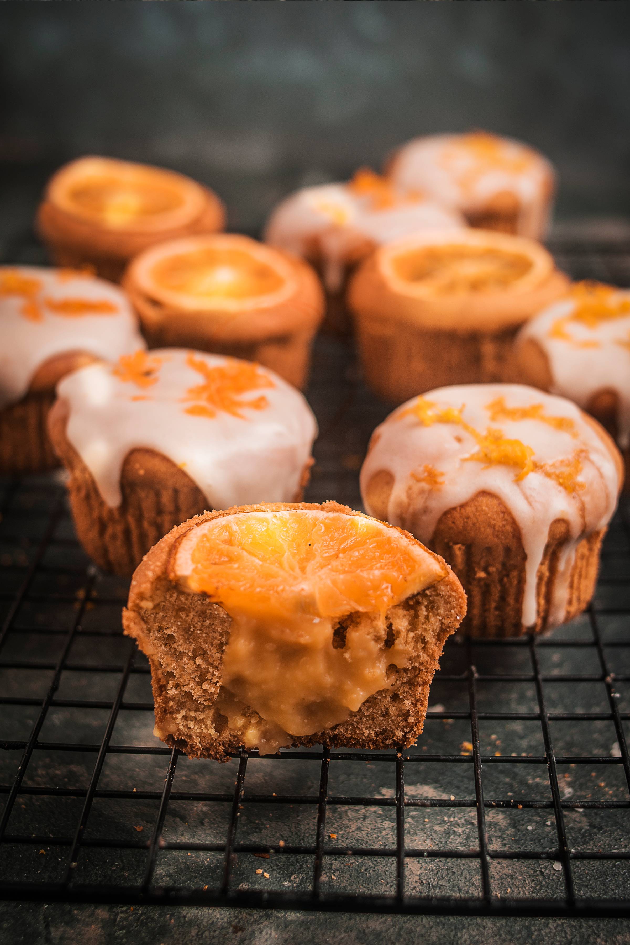 Blood orange curd cupcakes with a pale sponge and deep ruby citrus centre