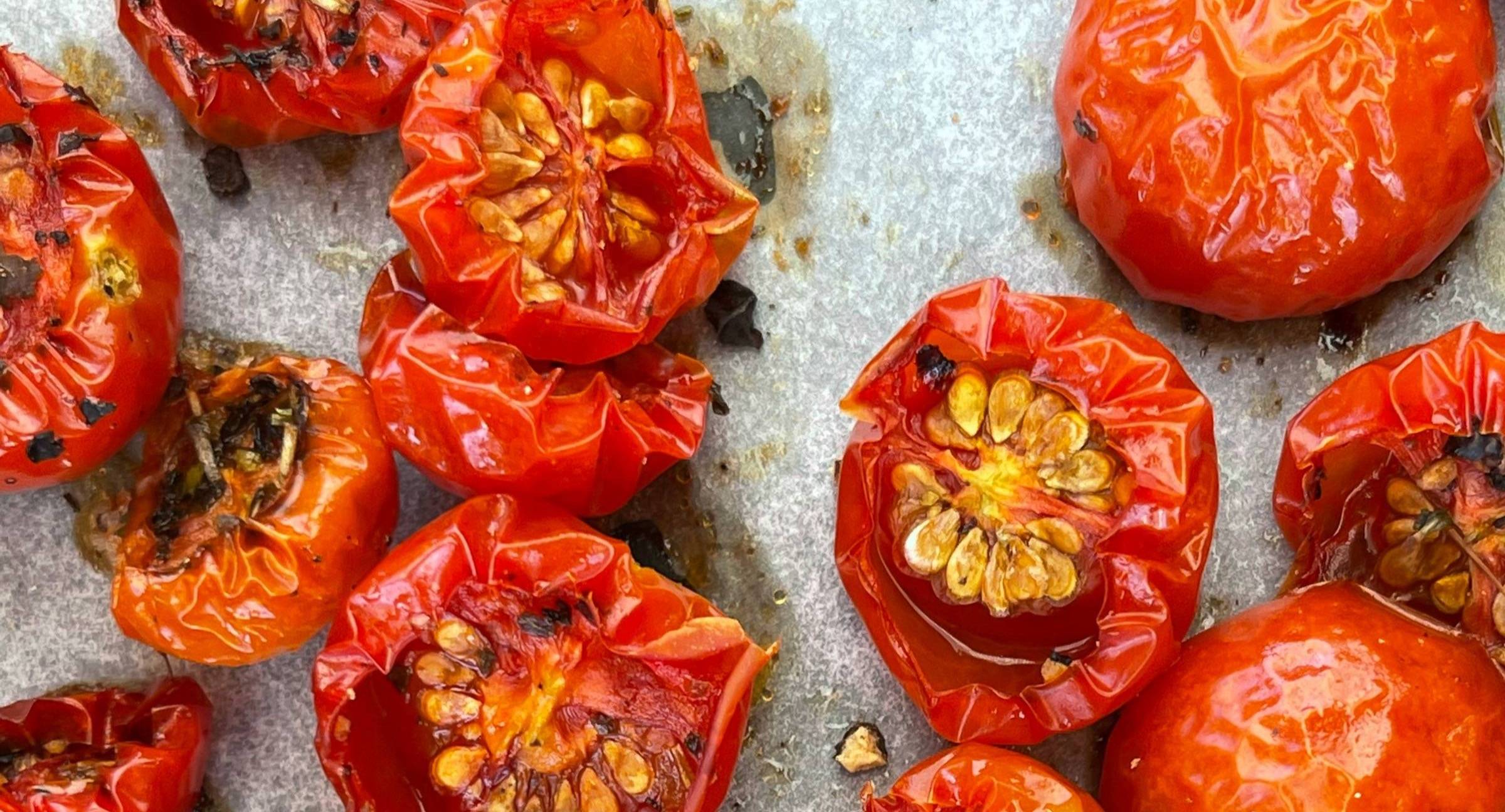 Roasted sunblush tomatoes on a baking tray