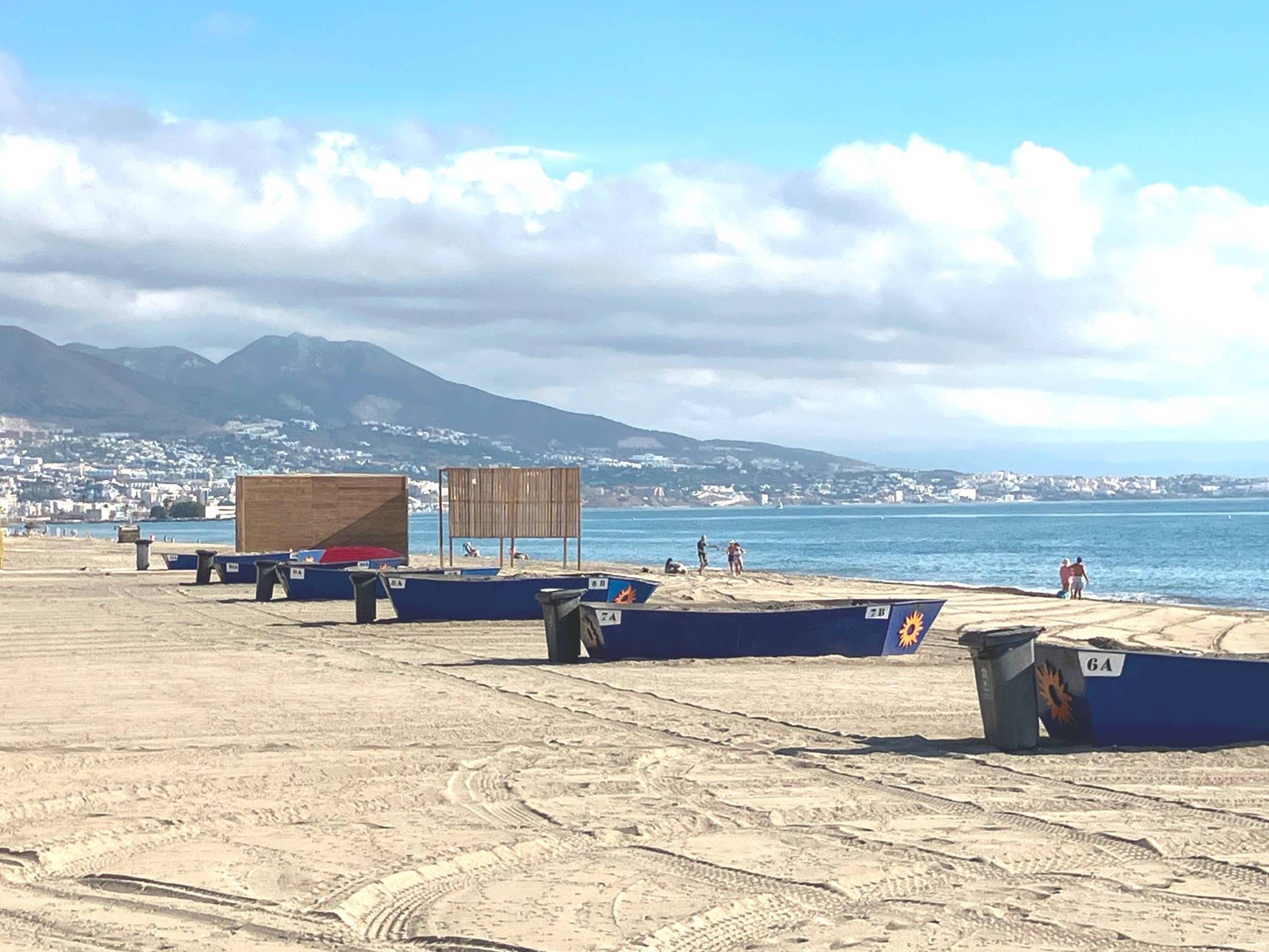 Sandy beach in Fuengirola on Spain’s Costa del Sol with the Mediterranean and mountains in the background