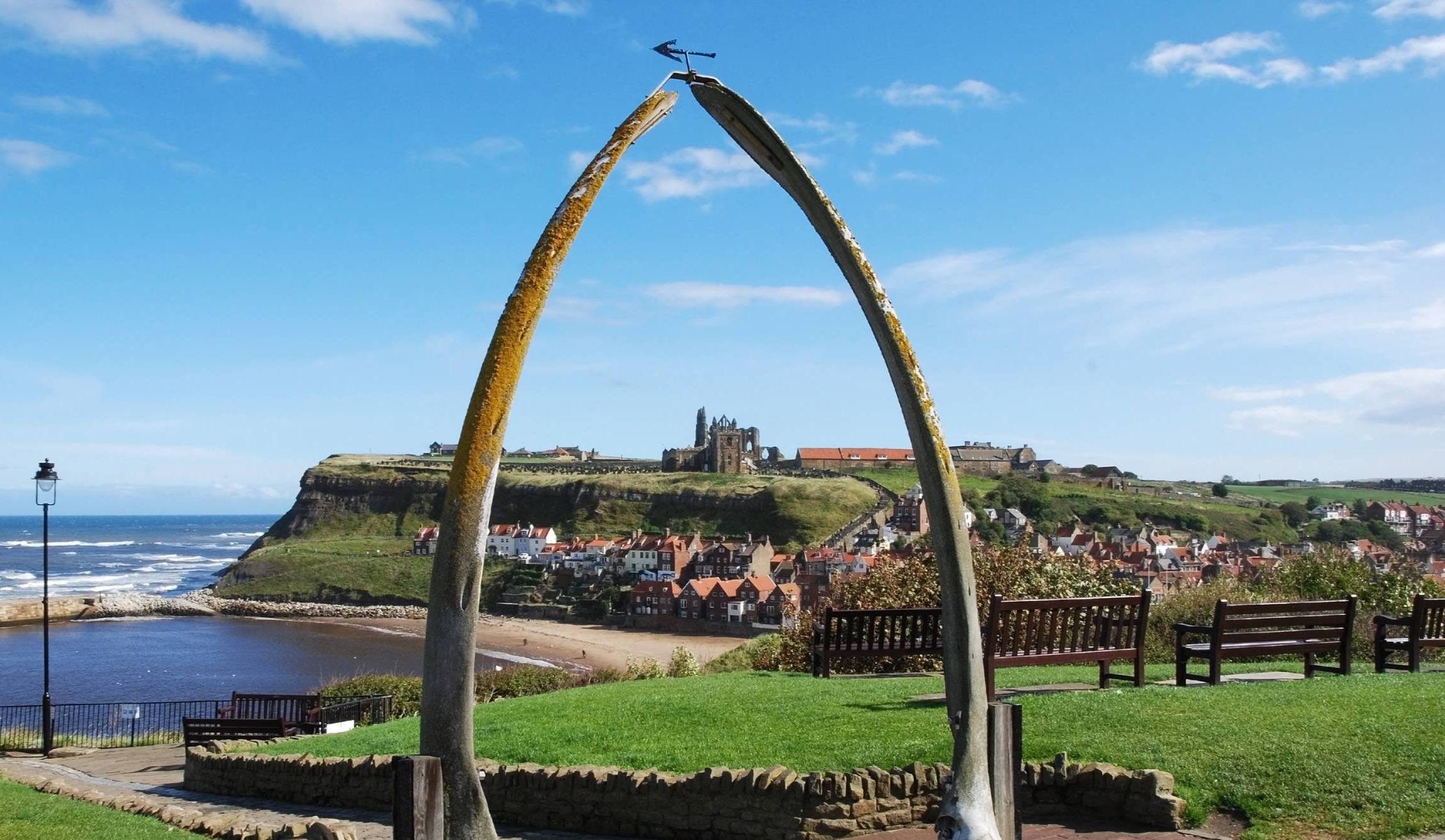 Whitby Abbey framed by the whale bone arch overlooking the North Sea at Whitby, North Yorkshire