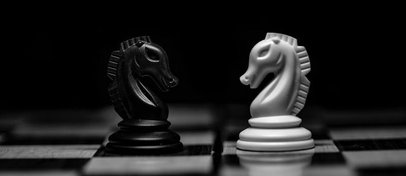 white ceramic figurine on black table