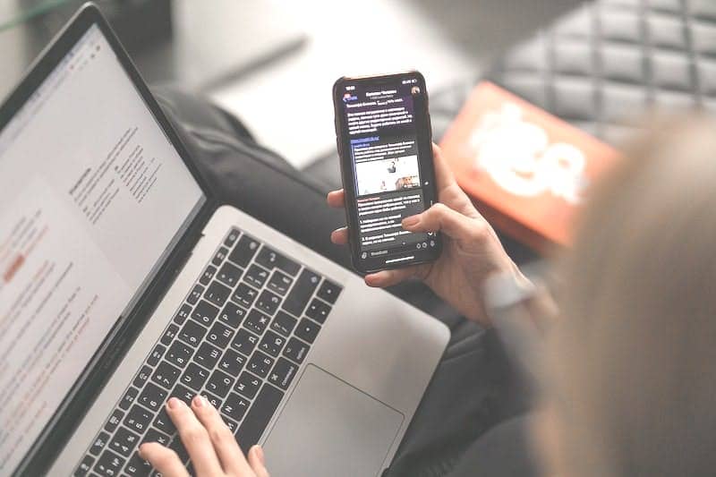 person holding black iphone 4