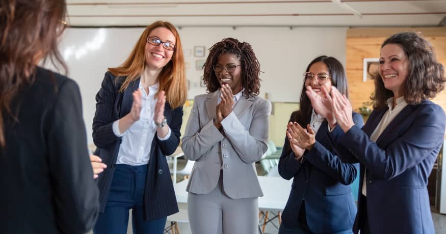 women clapping employees