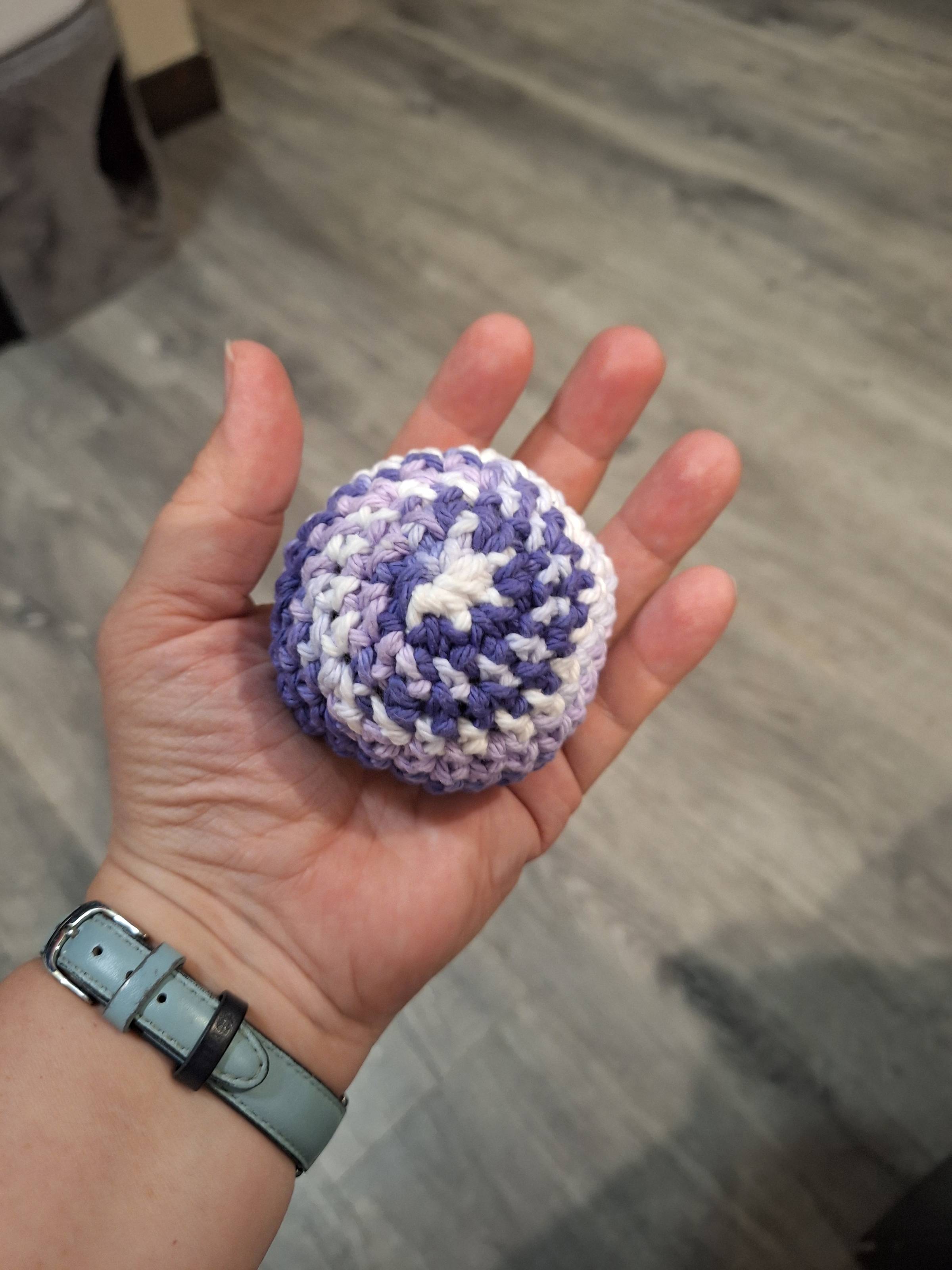 hand holding a hacky sack