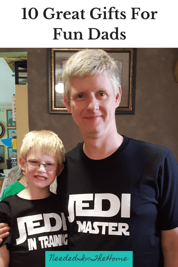 father and son wearing matching jedi shirts