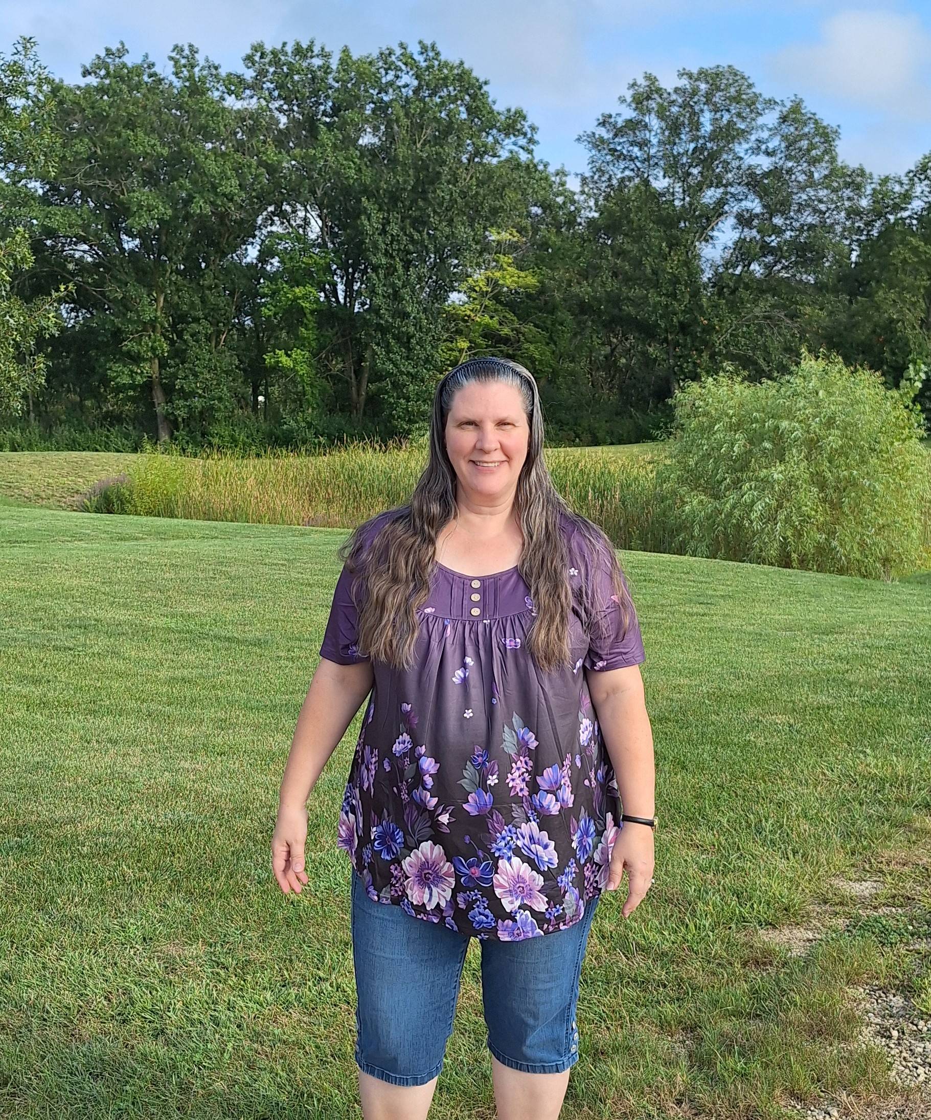 amy at neededinthehome in purple floral shirt