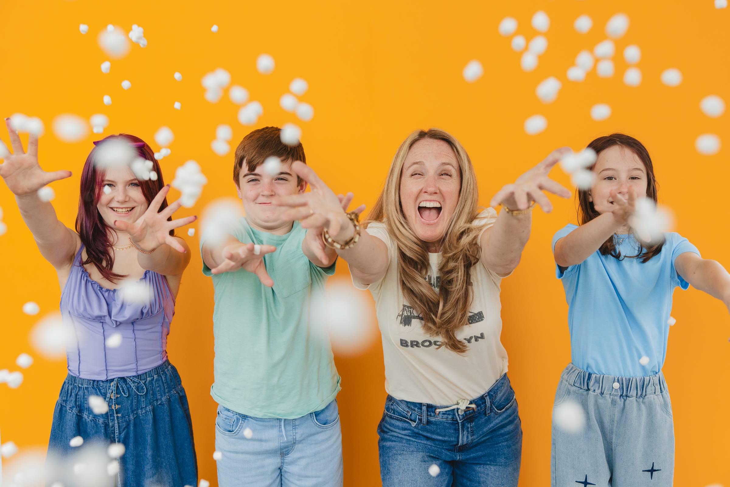 Jessica and her students throwing mini-marshmallows at the camera