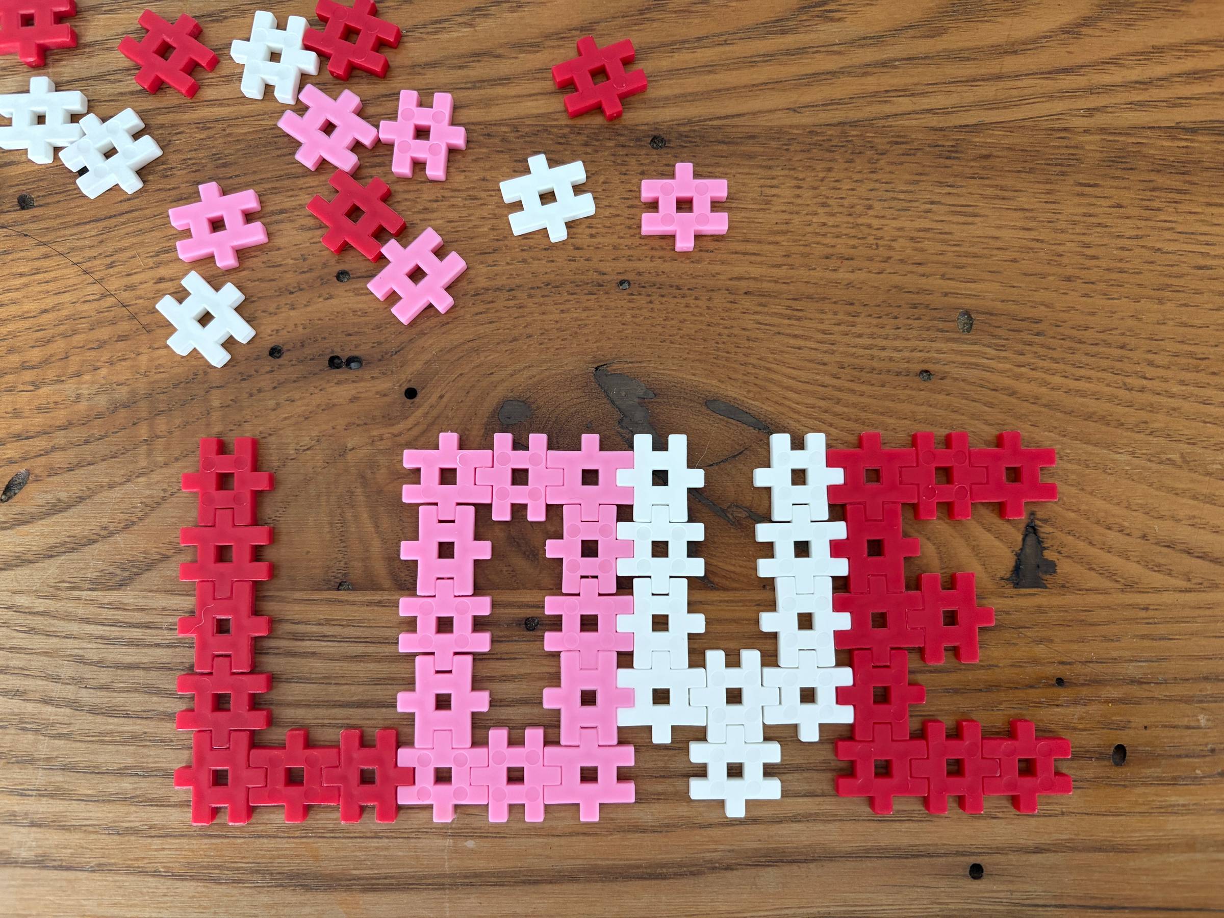 The word “love” written with interlocking bricks on a tabletop