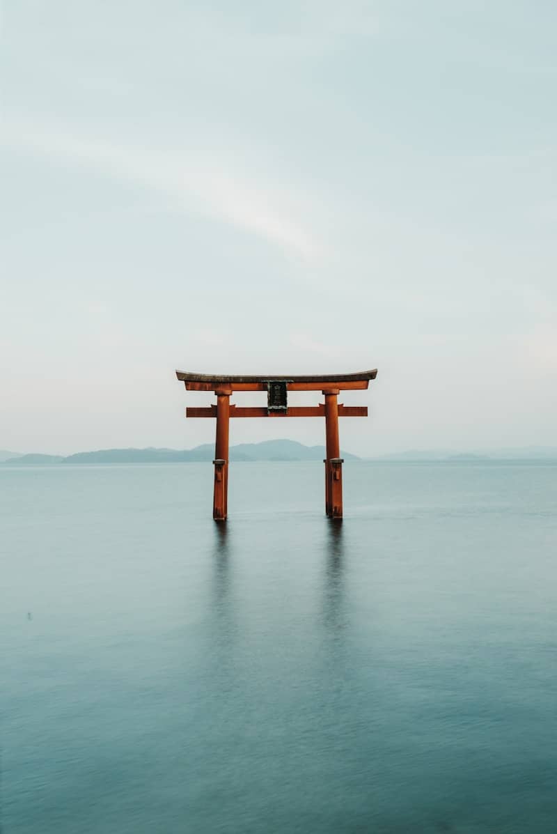 a large body of water with a wooden structure in the middle of it