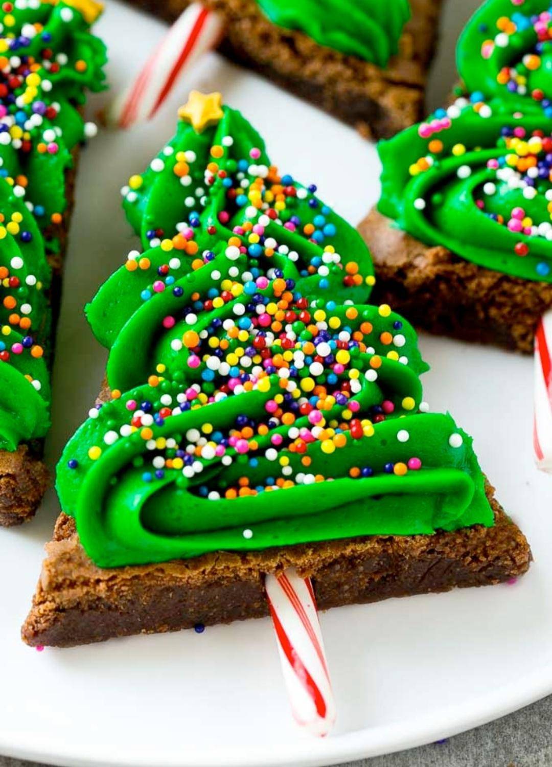 Christmas Tree Biscuit covered in Green Icing and sprinkles