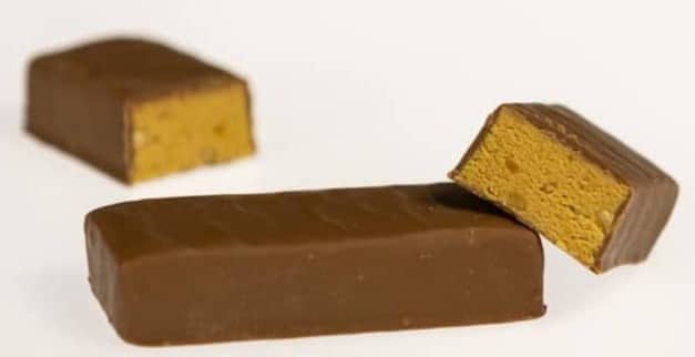 a couple of pieces of chocolate sitting on top of each other