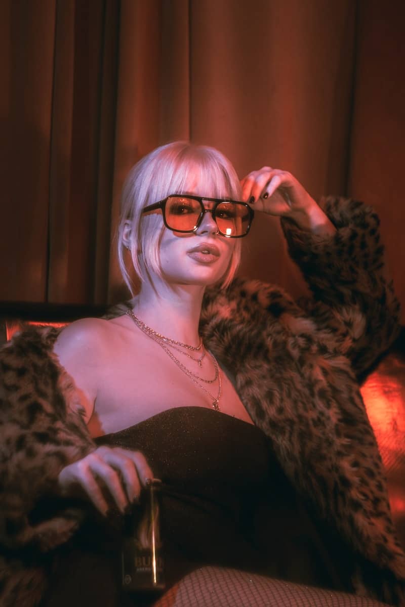 Woman in sunglasses and fur coat