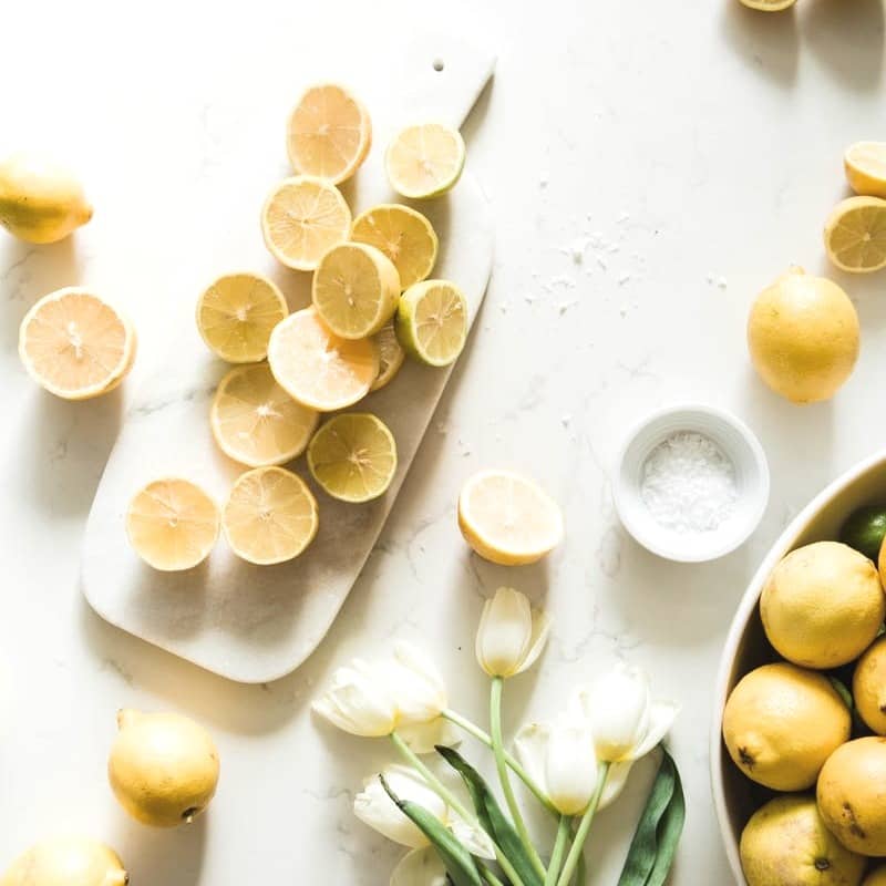 sliced lemon on white ceramic plate