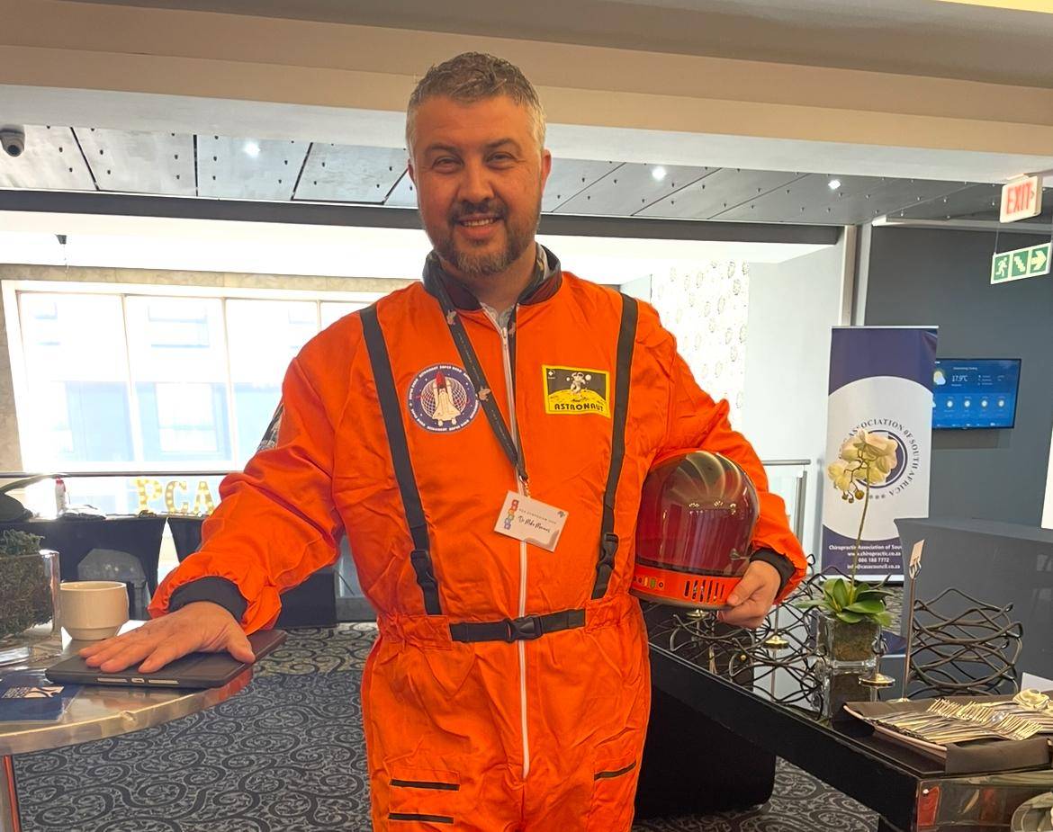 Mike wearing an orange space suit