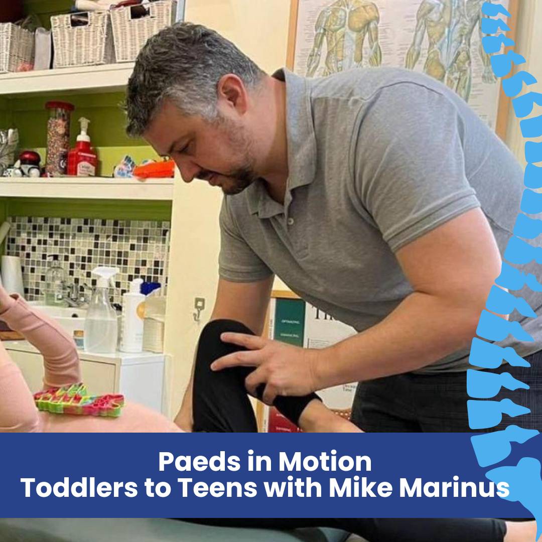 Mike with a child in the clinic