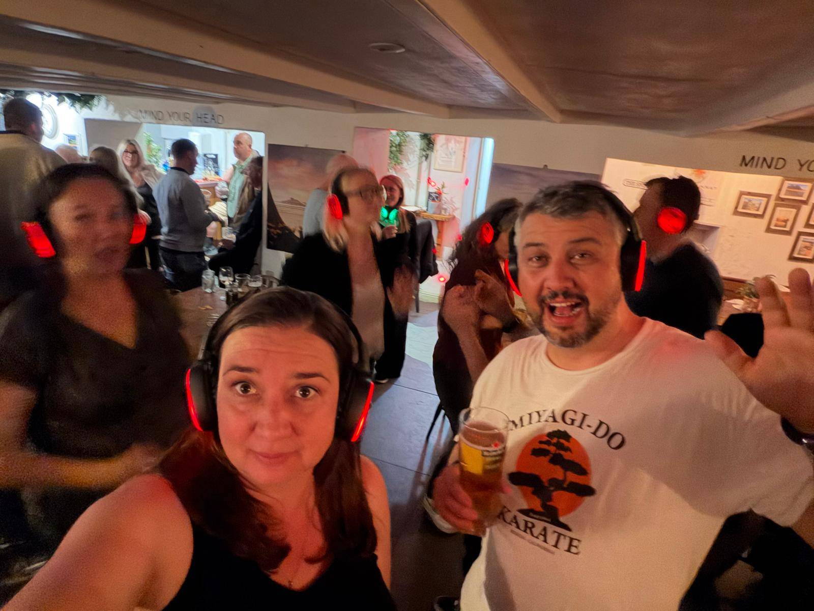 Mike and Nicky at the Silent Disco wearing headphones