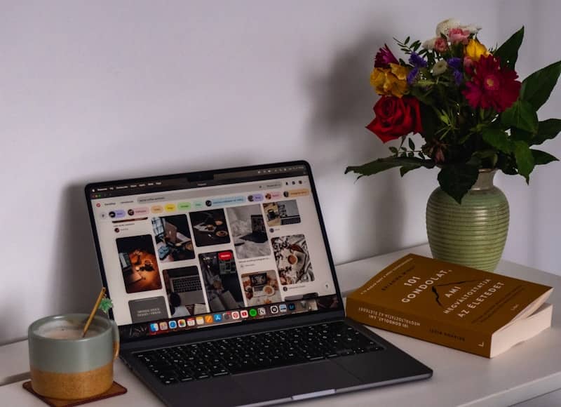 A laptop computer sitting on top of a white desk