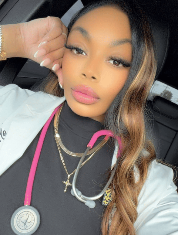 Chelsea Barnes, MSN, RN, FNP, smiling in a selfie while wearing a pink stethoscope