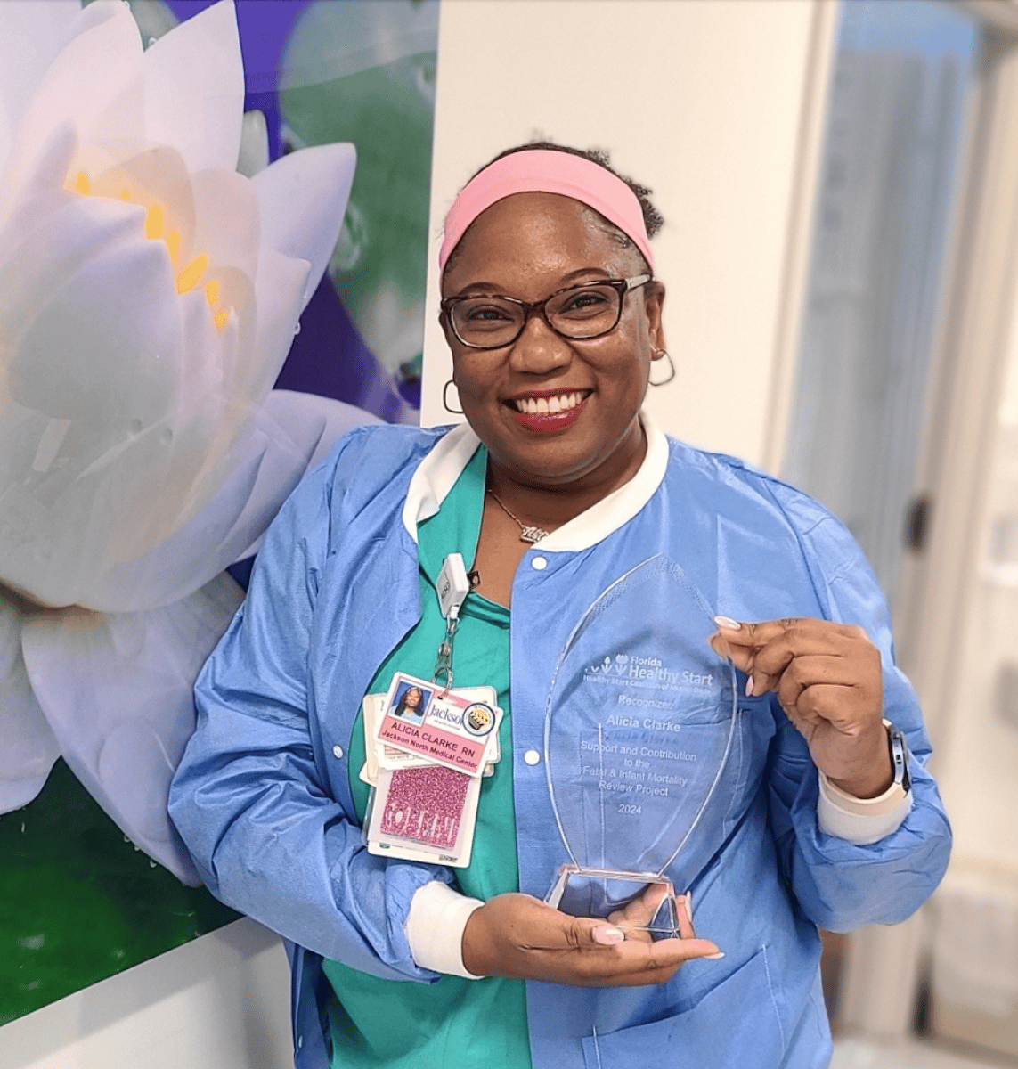 Labor and delivery nurse smiling in scrubs at the hospital