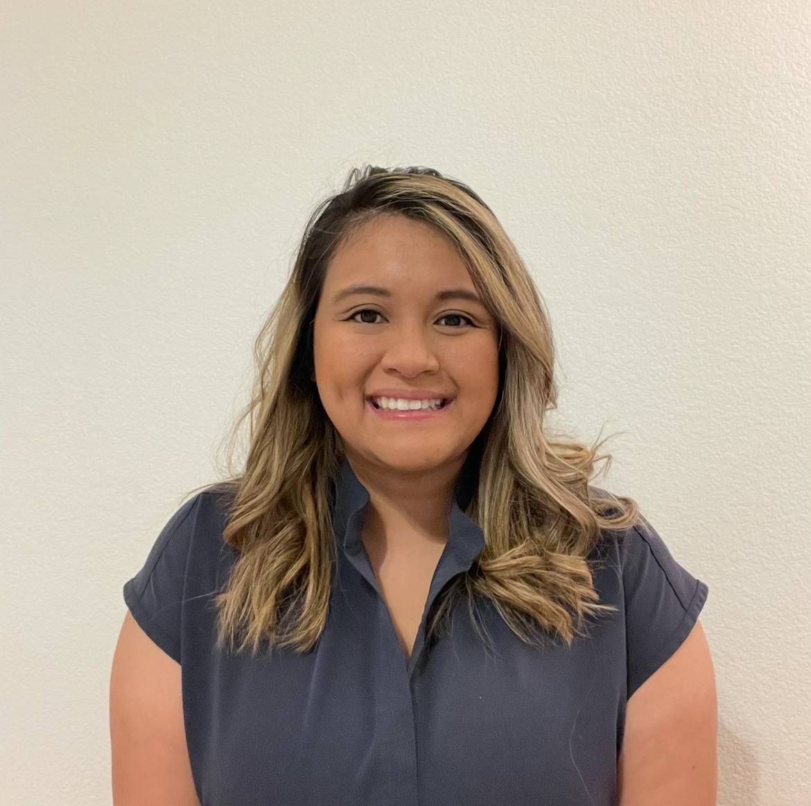 Andrea Noble, RN, BSN, smiles in a headshot.