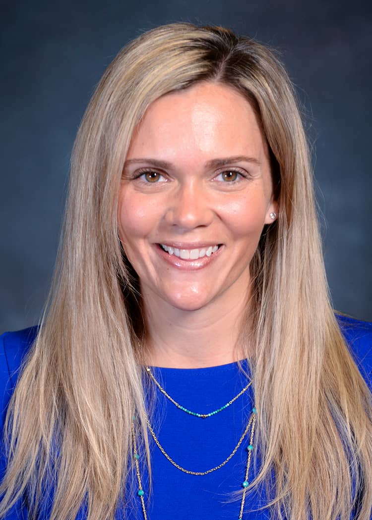 Dr. Megan McDowell, DNP, MSN, RN, CNE, is pictured smiling in a headshot.