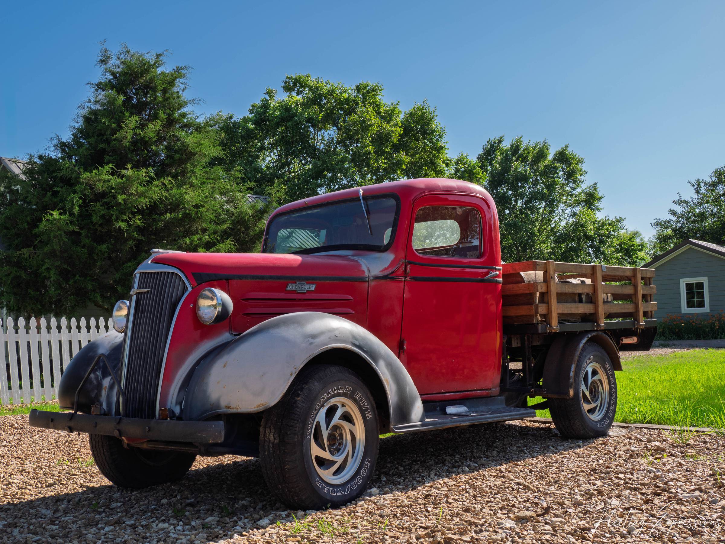 Vintage red Chevrolet pickup with wooden bed at Red Oak II ghost town near Carthage, MO