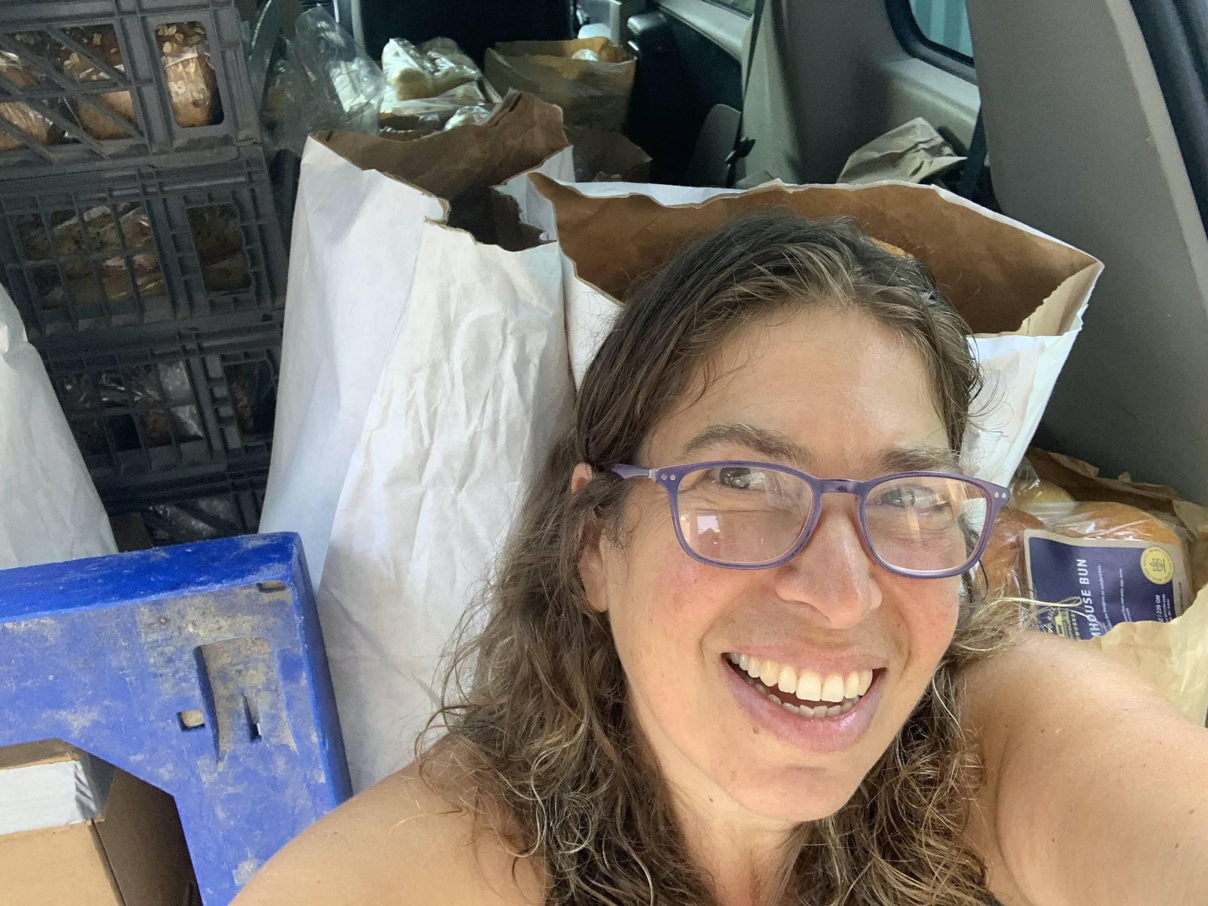 Selfie in front of well packed bread van!